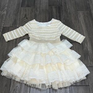 Girls gold shimmer long sleeve dress with a layered ruffle lace and tulle bottom